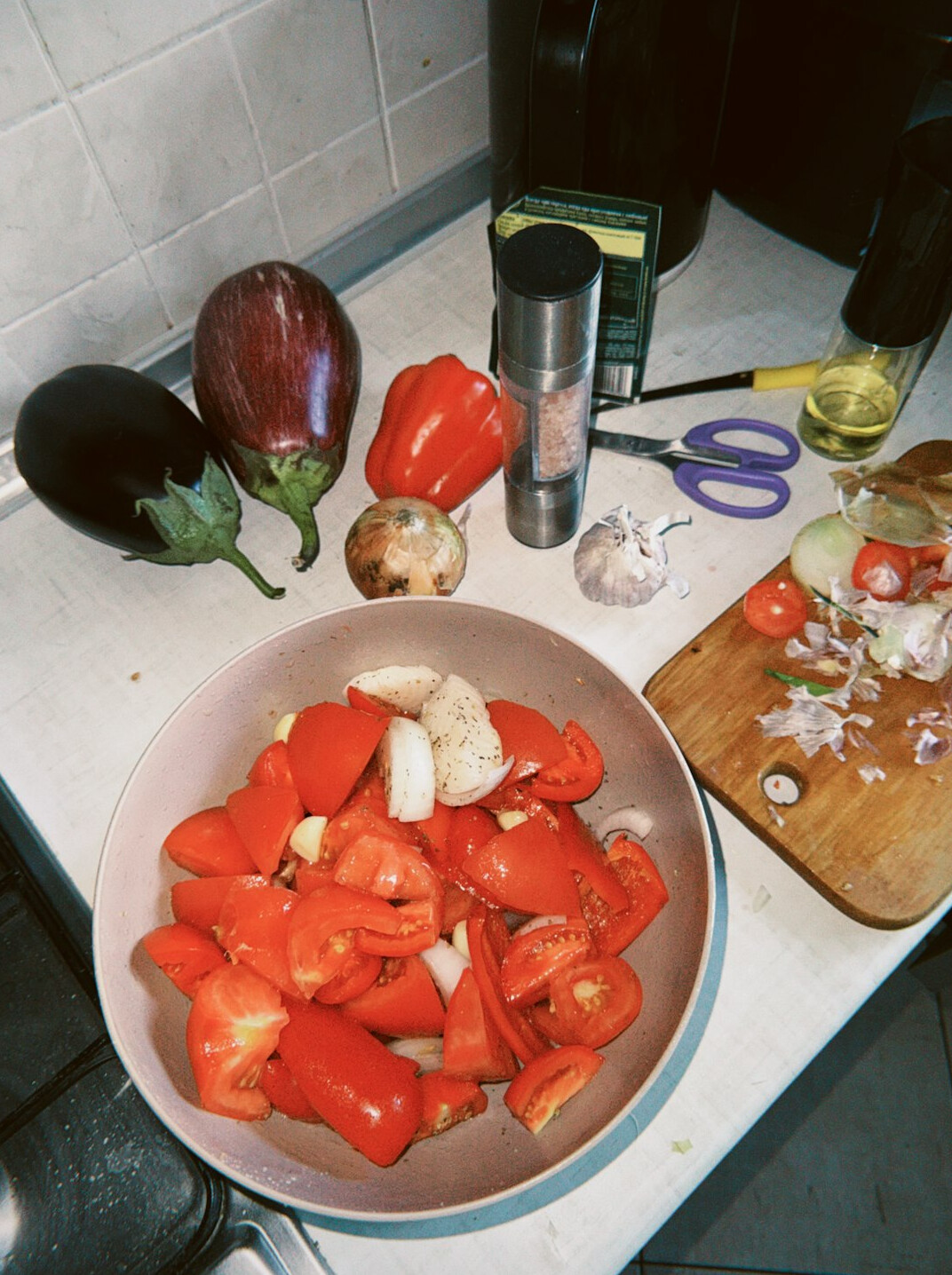 Fresh vegetables and ingredients on a kitchen counter