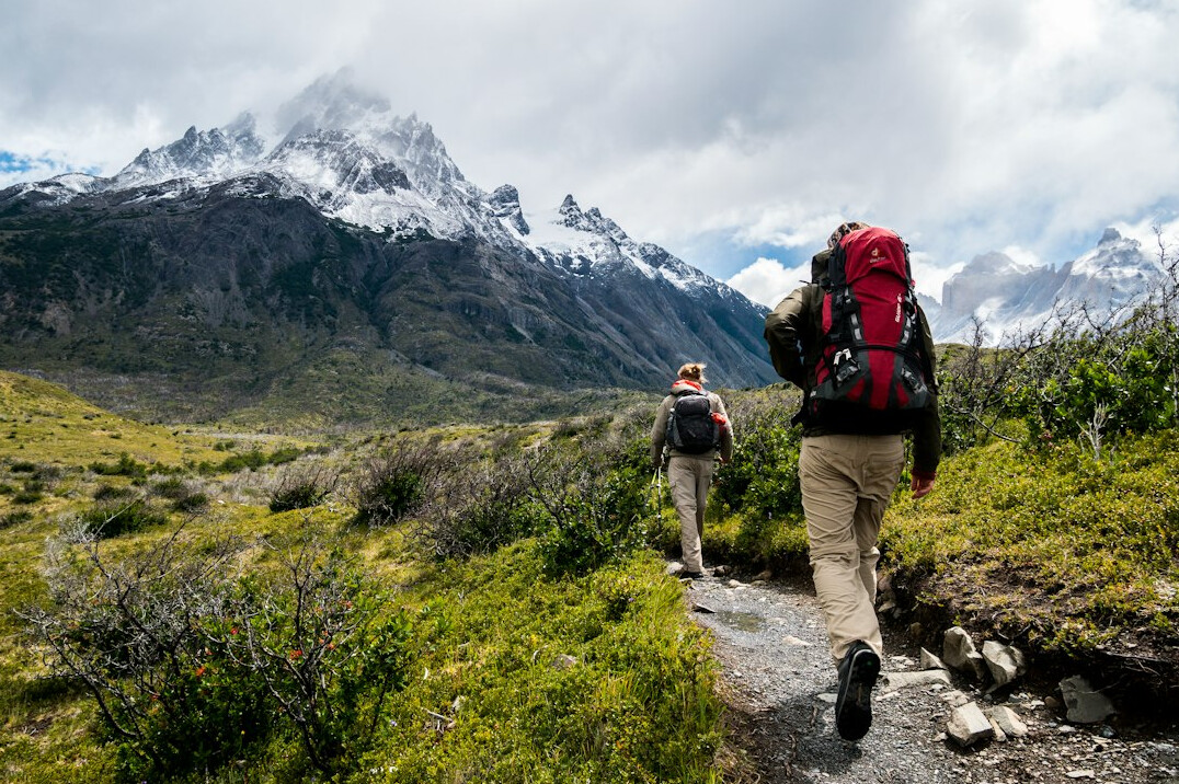 elderly person hiking in mountains