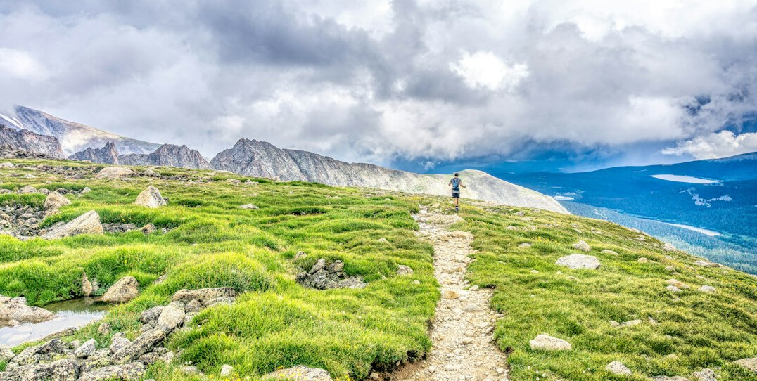 hiker on mountain trail